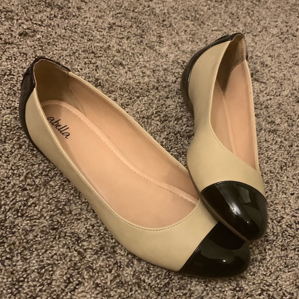 Tan and black flats